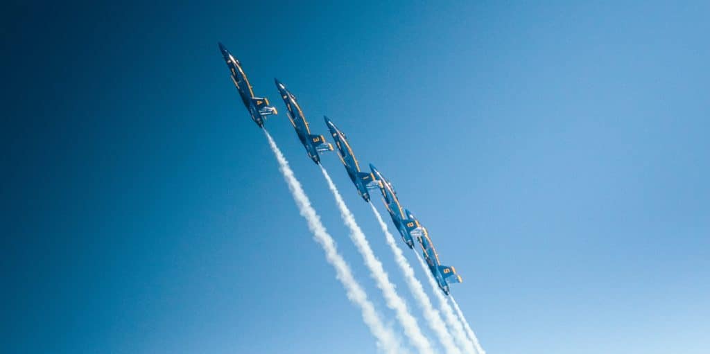 Jets are flying against a clear blue sky, indicating how high you can fly with outsourced sales
