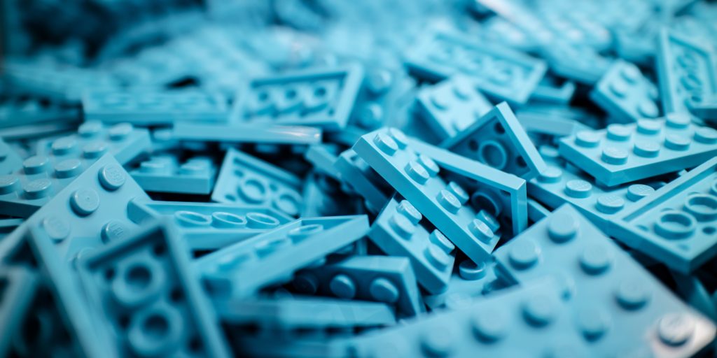 Blue Lego pieces symbolise the building blocks for a repeatable sales motion.
